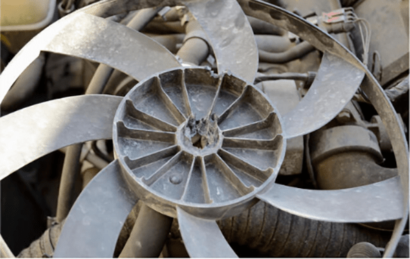 broken engine cooling fan with a lot of dust